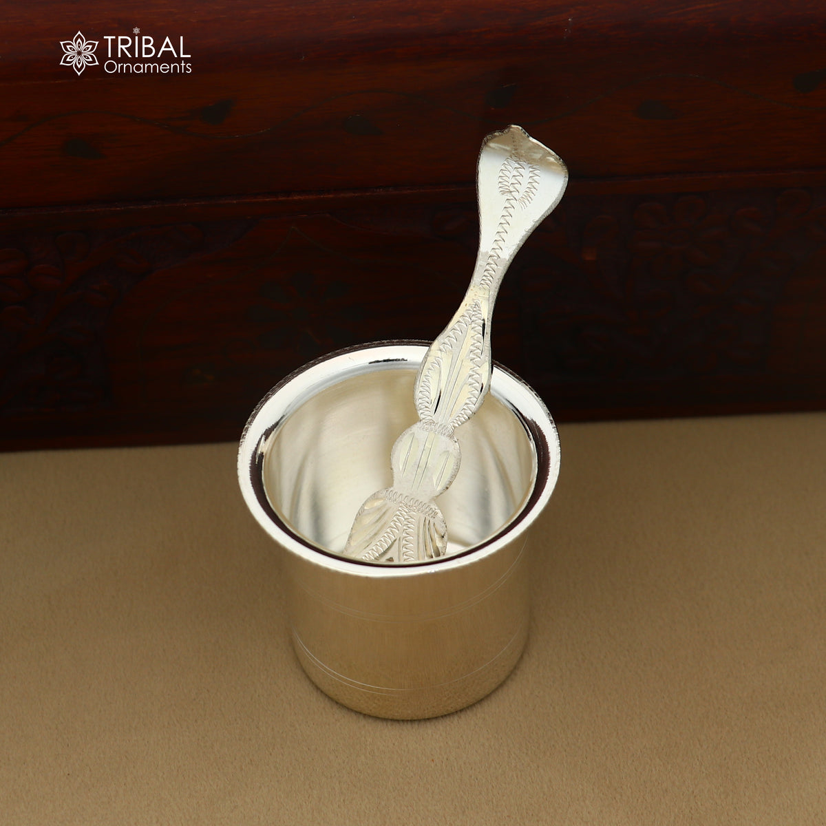 Solid sterling silver ghee pot with handle, traditional butter pot for kitchen use, part of silver puja utensils collection.