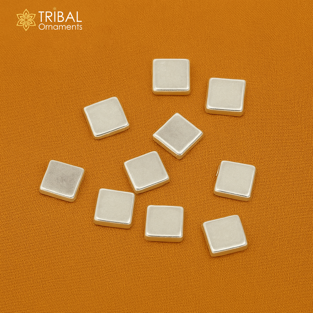Tiny silver Barfi sweets for Diwali puja, intricate silver cake Prasadam from Tribal Ornaments, Indian worshipping silver article.