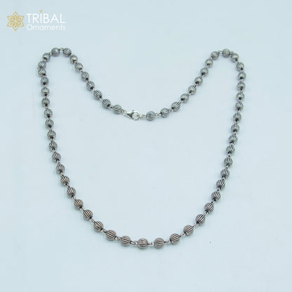 Sterling silver 4mm beaded chain necklace by TRIBAL ORNAMENTS, featuring a delicate, handmade unisex jewelry design.