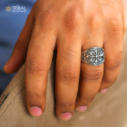 Sterling silver men's ring with a detailed flower design by TRIBAL ORNAMENTS, showcasing intricate silver jewelry craftsmanship.