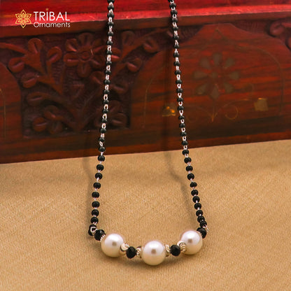 Sterling silver black bead chain necklace with small silver bead pendant, traditional beaded jewelry by Tribal Ornaments.