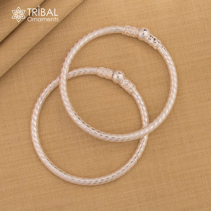 Sterling silver single ball bangle bracelet by Tribal Ornaments, unisex handmade tribal jewelry with a sleek shine and simple design.