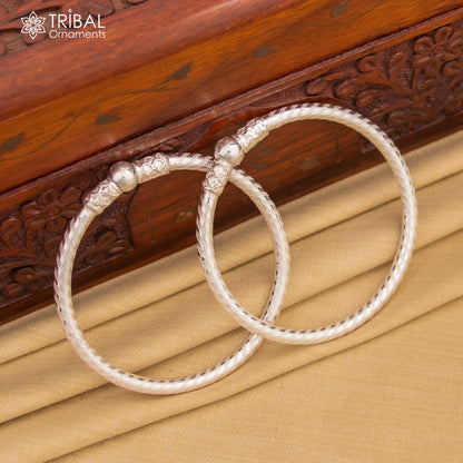 Sterling silver single ball bangle bracelet by Tribal Ornaments, unisex handmade jewelry with a shiny, minimalist design.