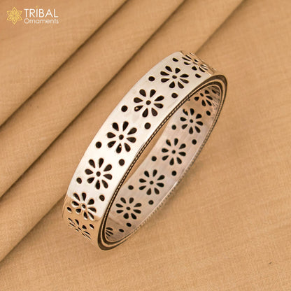 Sterling silver floral work bangle bracelet by TRIBAL ORNAMENTS, stylish jewelry for brides, featuring intricate floral design.