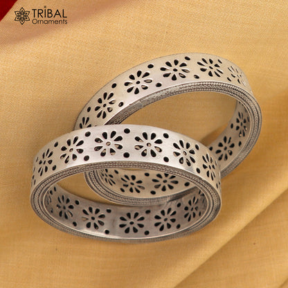 Sterling silver floral work bangle bracelet by TRIBAL ORNAMENTS, stylish bridal jewelry with intricate floral designs.