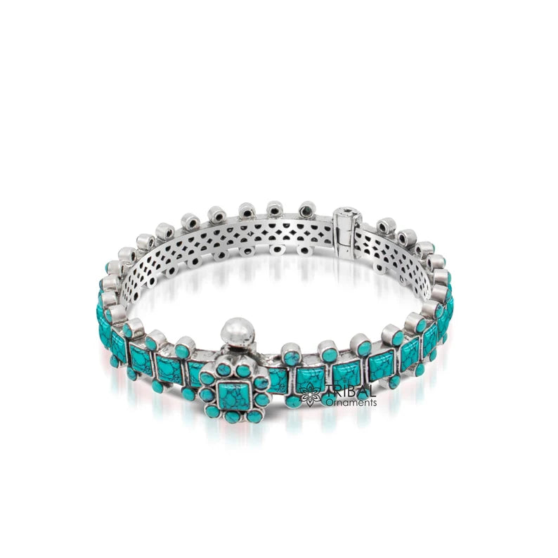 Sterling silver tribal bangle bracelet with turquoise stone, handcrafted stylish jewelry suitable for weddings and gifting.