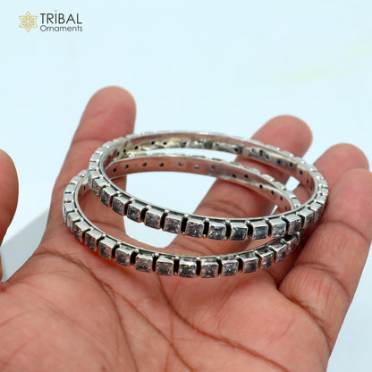 Sterling silver bangle bracelet with cubic zirconia stones, vintage tribal jewelry design, perfect for wedding or anniversary gift.