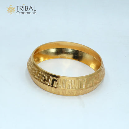 Stylish heavy silver bangle or kada with gold polish, made of 999 pure silver, from TRIBAL ORNAMENTS.