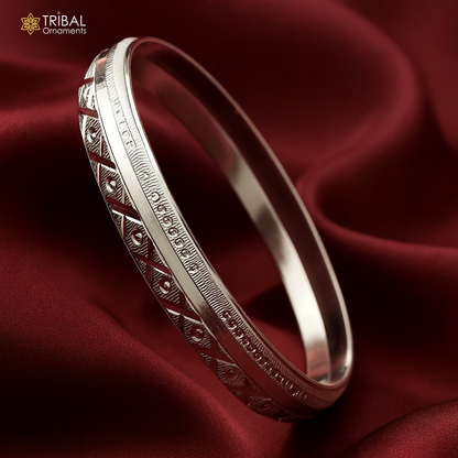 Heavy 999 pure silver men's bangle kada by Tribal Ornaments, stylish and heavy design with intricate tribal patterns.