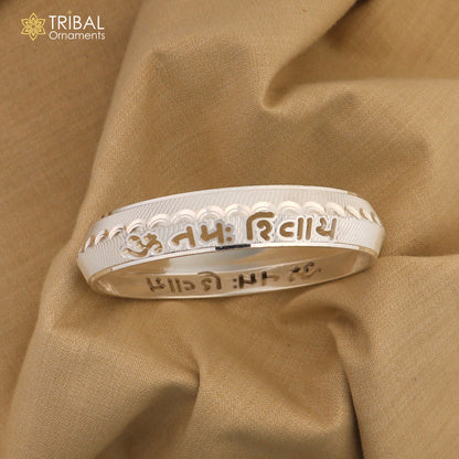 Pure silver Om Namah Shivay bangle from Tribal Ornaments, featuring a shiny Shiva mantra design in NSK925 silver.