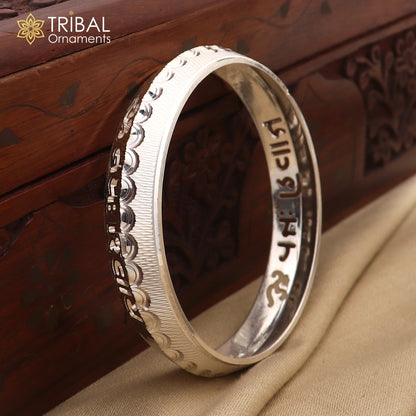 Silver bangle with Om Namah Shivay and Shiva mantra design, crafted from 999 pure silver, stylish and shiny tribal ornament.