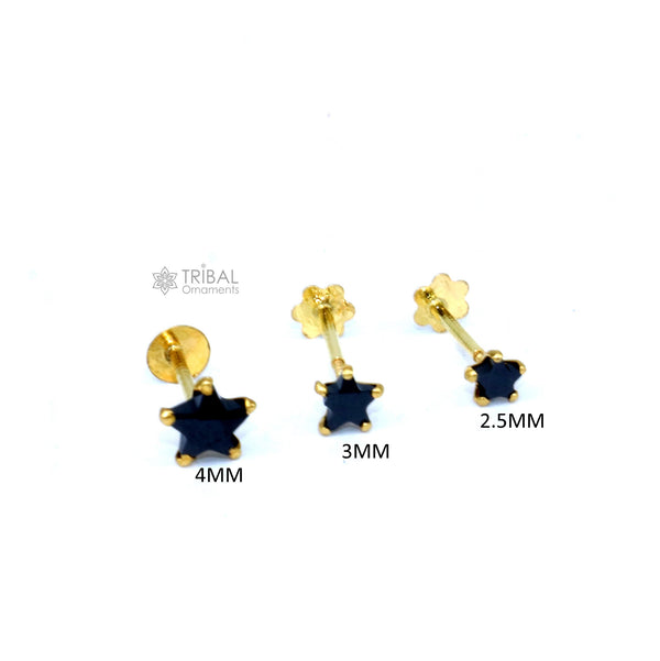 18kt yellow gold handmade star-shaped black onyx cartilage stud earring in various sizes, unisex jewelry by TRIBAL ORNAMENTS.