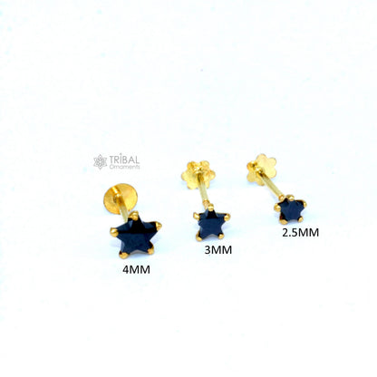 18kt yellow gold handmade star-shaped black onyx cartilage stud earring in various sizes, unisex jewelry by TRIBAL ORNAMENTS.