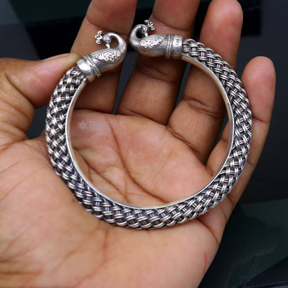 Sterling silver handmade vintage peacock bangle bracelet by TRIBAL ORNAMENTS, unisex, customized hip-hop jewelry with intricate design.