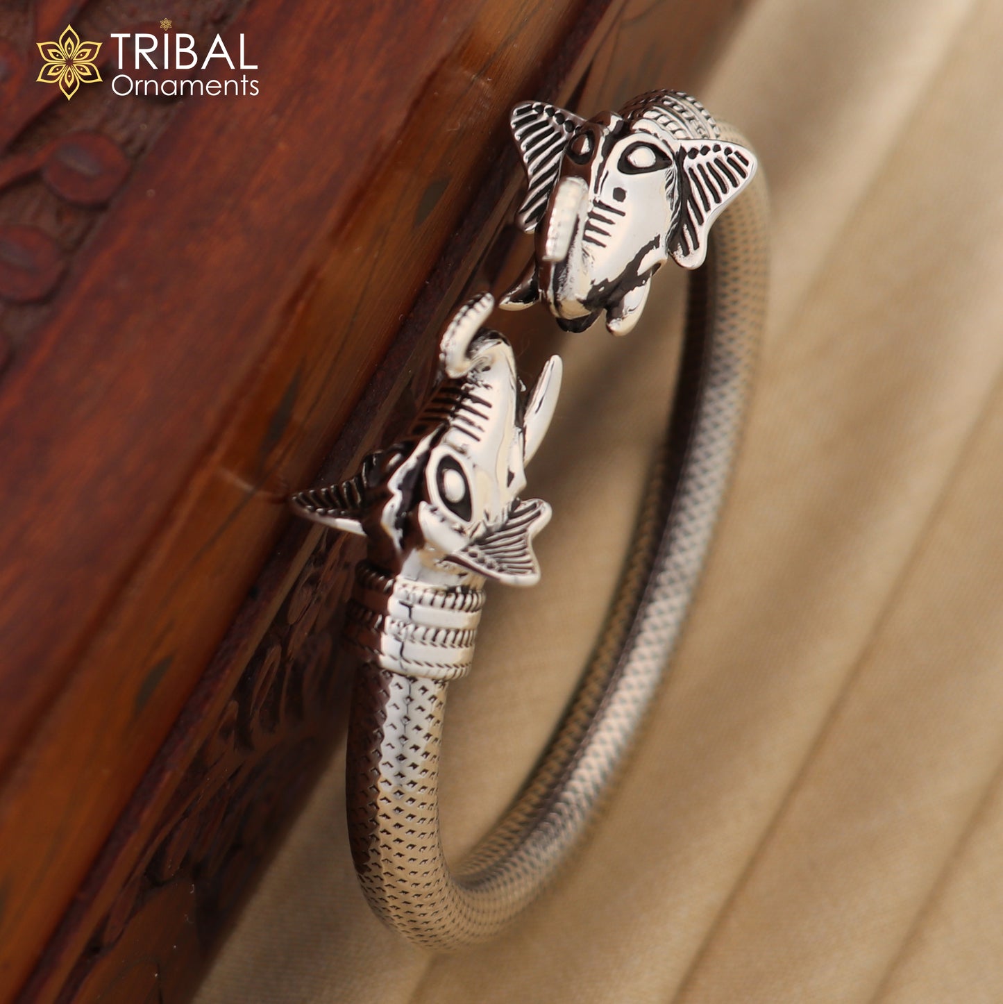 Sterling silver elephant face bangle bracelet from TRIBAL ORNAMENTS, unisex silver kada jewelry with detailed elephant design.