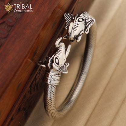 Sterling silver elephant face bangle bracelet from TRIBAL ORNAMENTS, unisex silver kada jewelry with detailed elephant design.