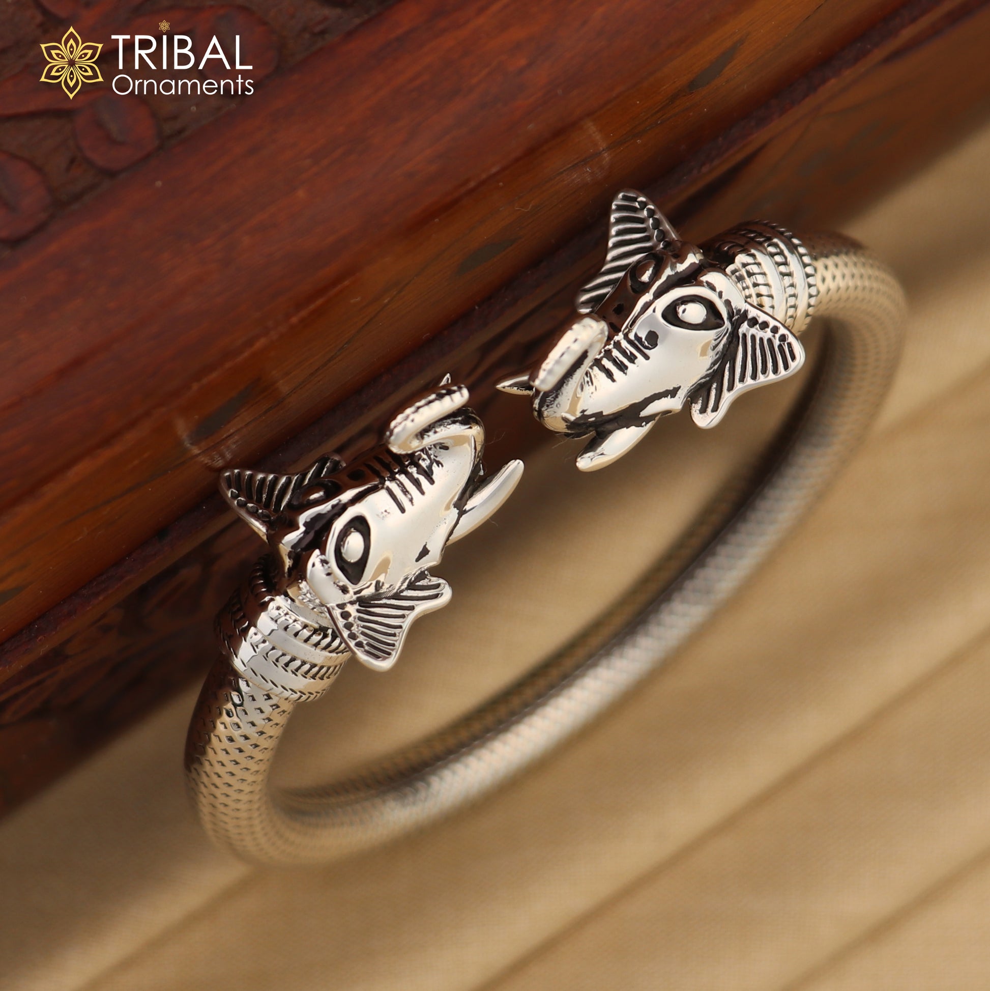 Sterling silver elephant face bangle bracelet by TRIBAL ORNAMENTS, unisex jewelry with detailed elephant design, 2.375 inches.