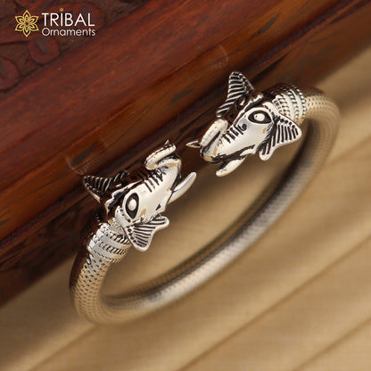 Sterling silver elephant face bangle bracelet by TRIBAL ORNAMENTS, unisex jewelry with detailed elephant design, 2.375 inches.
