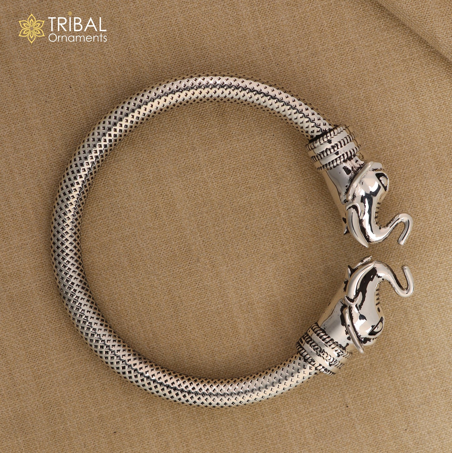 Sterling silver elephant face bangle bracelet by TRIBAL ORNAMENTS, unisex silver kada with detailed elephant design.