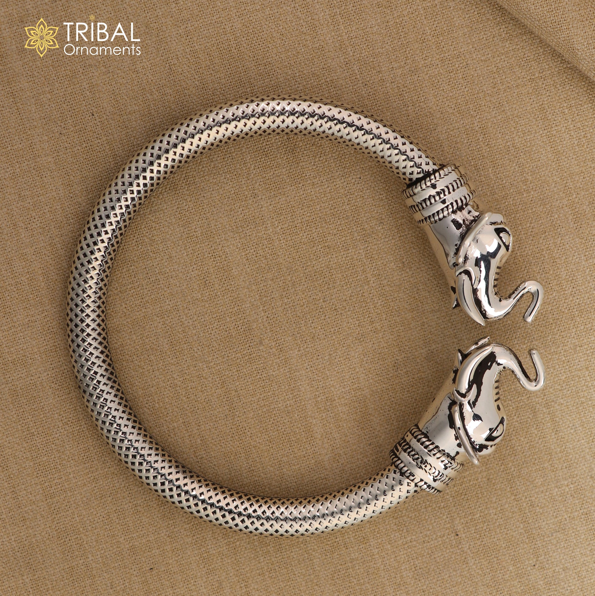 Sterling silver elephant face bangle bracelet by TRIBAL ORNAMENTS, unisex silver kada with detailed elephant design.