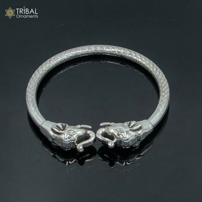 Handmade 925 sterling silver elephant design bangle bracelet by TRIBAL ORNAMENTS, showcasing intricate tribal-inspired details.