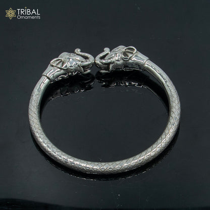 Sterling silver handmade elephant design bangle bracelet by TRIBAL ORNAMENTS, featuring intricate tribal patterns and detailed elephant motif.