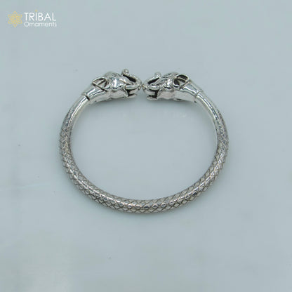 Handmade 925 sterling silver elephant design bangle bracelet with intricate tribal ornament details, showcasing craftsmanship and style.