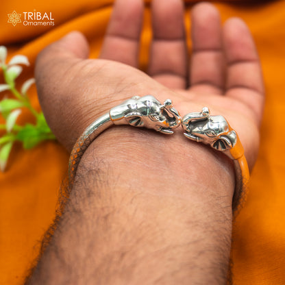 Handmade 925 sterling silver elephant design bangle bracelet by TRIBAL ORNAMENTS, showcasing detailed craftsmanship and traditional style.