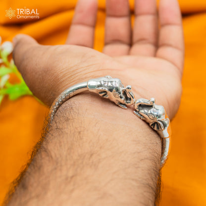 Sterling silver handmade Elephant design bangle bracelet by TRIBAL ORNAMENTS, showcasing detailed elephant motifs on a silver kada bracelet.