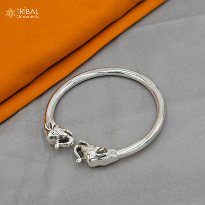 Handmade 925 sterling silver Elephant design bangle bracelet by TRIBAL ORNAMENTS, featuring detailed elephant motifs and a sleek finish.