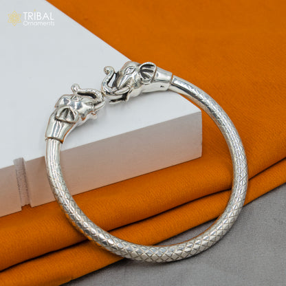 Handmade 925 sterling silver elephant design bangle bracelet by TRIBAL ORNAMENTS, showcasing intricate tribal jewelry craftsmanship.