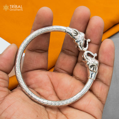 Handmade 925 sterling silver elephant design bangle bracelet by TRIBAL ORNAMENTS, featuring intricate tribal detailing.