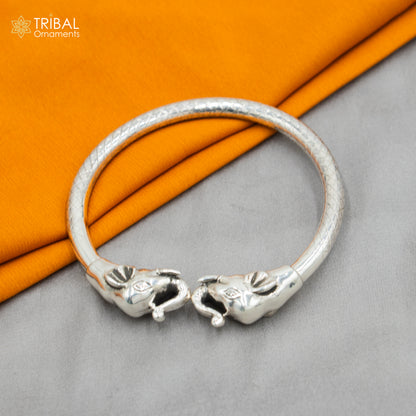 Handmade 925 sterling silver elephant design bangle bracelet with intricate tribal ornament details and adjustable size.