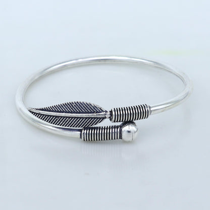 Sterling silver handmade leaf design kada bangle bracelet by Tribal Ornaments, showcasing tribal jewelry style and intricate craftsmanship.
