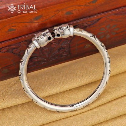 Sterling silver lion face design bangle bracelet by Tribal Ornaments, handcrafted unisex jewelry, 2.375-inch size.
