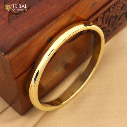 Shiny round flat Ashtdhatu kada bangle from TRIBAL ORNAMENTS, unisex jewelry with customized plain design.