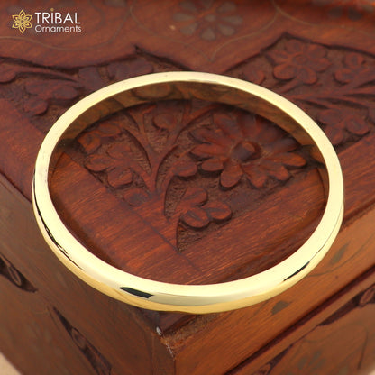Shiny round flat Ashtdhatu kada bangle from TRIBAL ORNAMENTS, unisex jewelry with customized plain design in metal bracelet style.