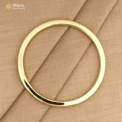 Shiny unisex Ashtdhatu Kada bangle with round tube design from Tribal Ornaments, customized plain jewelry for everyday wear.