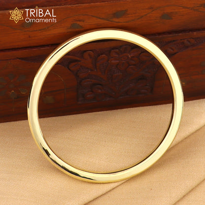 Shiny unisex Ashtdhatu kada bangle with round tube design, customized plain finish, from Tribal Ornaments jewelry collection.