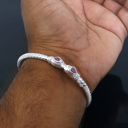 Sterling silver tribal bangle bracelet featuring a detailed lion face design, handmade tribal jewelry by Tribal Ornaments.