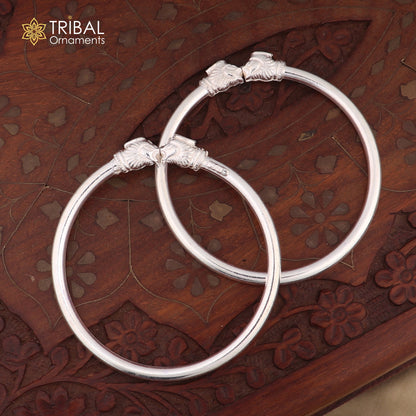 Sterling silver tribal bangle bracelet with a detailed lion face design, handmade tribal jewelry by Tribal Ornaments.