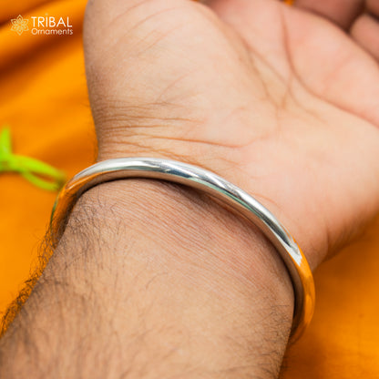 Sterling silver handmade elephant design bangle bracelet by TRIBAL ORNAMENTS, featuring a plain, smooth surface and traditional craftsmanship.