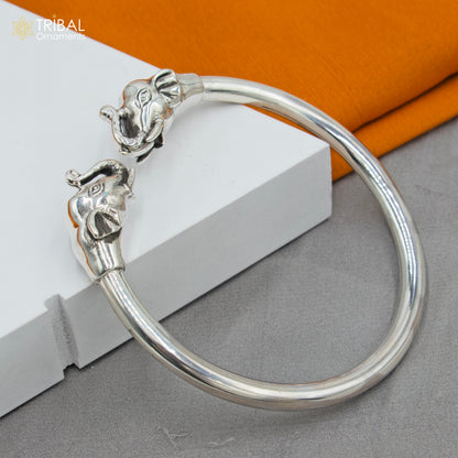 Sterling silver handmade elephant design bangle bracelet by Tribal Ornaments, plain silver Kada with intricate elephant motifs.