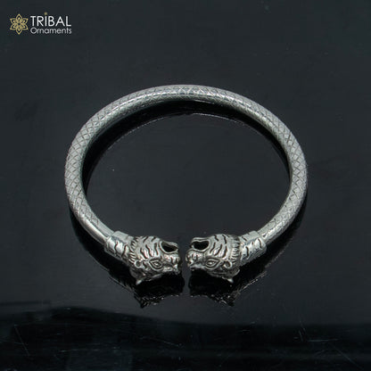 Handmade 925 sterling silver Lion face design bangle bracelet by TRIBAL ORNAMENTS, featuring intricate tribal craftsmanship.