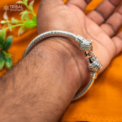 Sterling silver handmade lion face bangle bracelet by Tribal Ornaments, 2.5 to 2.8 inches, featuring intricate tribal design.