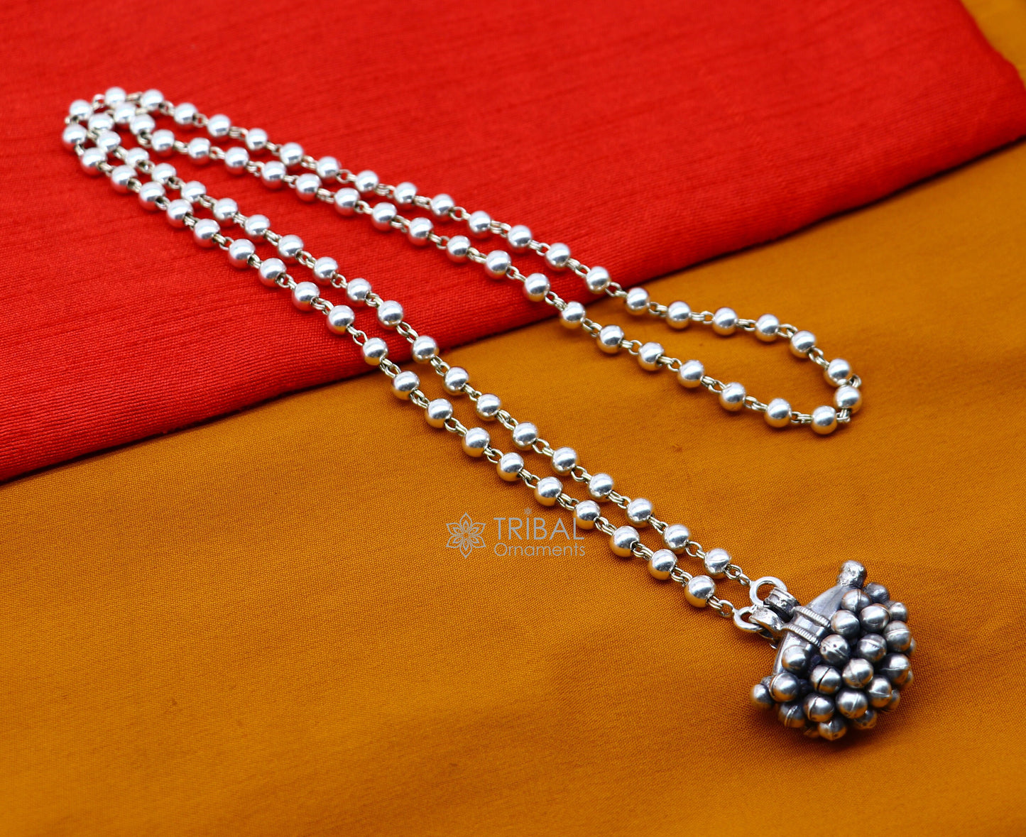 Sterling silver vintage tribal amulet box pendant necklace with intricate tribal and ethnic design, part of jewelry set.