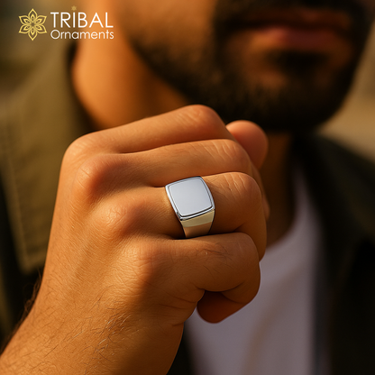 Sterling silver men's ring with tribal design, crafted by TRIBAL ORNAMENTS, showcasing intricate patterns on a smooth band.