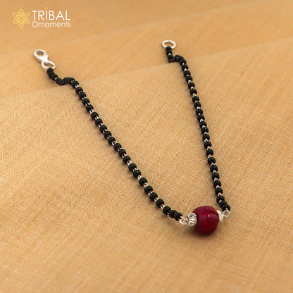 Sterling silver black beaded bracelet and anklet set by TRIBAL ORNAMENTS, featuring cultural design and versatile wear options.