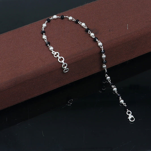 Sterling silver and black beaded chain bracelet by TRIBAL ORNAMENTS, versatile as bracelet or anklet, with pearl accents.