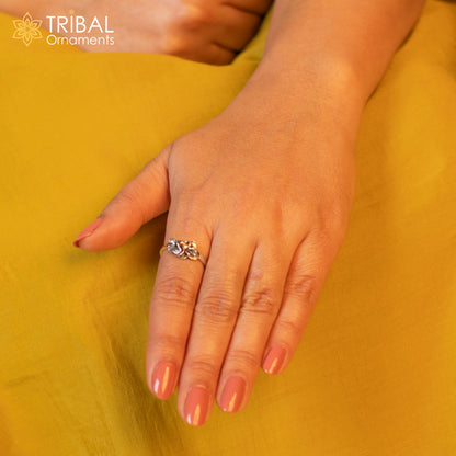 925 sterling silver flower design ring by TRIBAL ORNAMENTS featuring an intricate, stylish floral pattern on a jewelry piece.